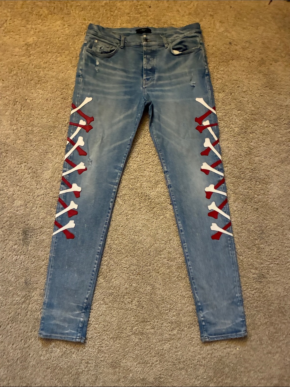 AMIRI Light Blue Skinny Jeans with Red & White Side Bone Lace